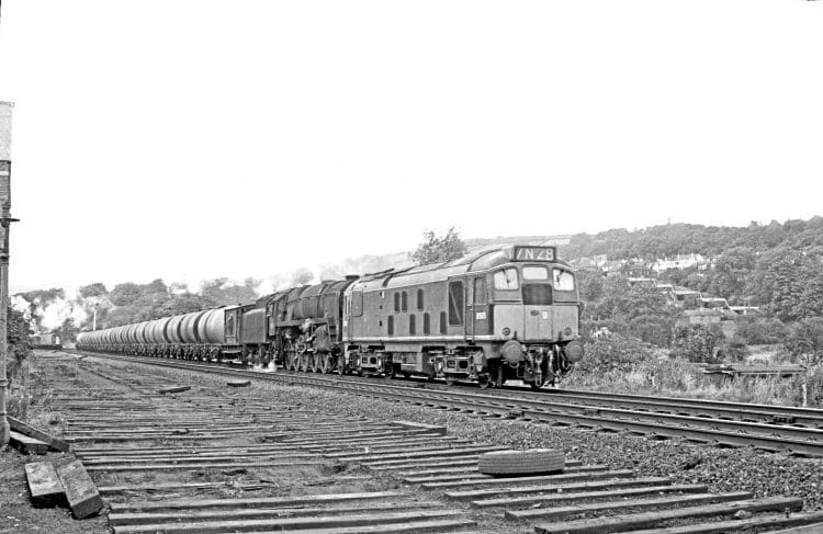 BR Sulzer Type 2 diesel D5075 and BR Standard 9F 2-10-0 No. 92118 approach Bingley with the Heysham-Neville Hill oil train on September 30, 1967. This combination of motive power continued to work this train after the end of steam in the West Riding. JOHN MARSH