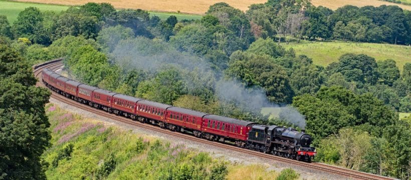 Cumbria has seen a typical British summer with cloud and occasional rain. On 13 July 2019 in a rare patch of good light, former LMS Stanier “Jubilee” 45690 "Leander", looking every inch the late 1950s and reunited with her original tender, powers around Armathwaite curve on the Settle – Carlisle line as she heads south with train 1Z87, the 14.12 Carlisle – Carnforth leg of the Euston bound "Cumbrian Mountain Express".