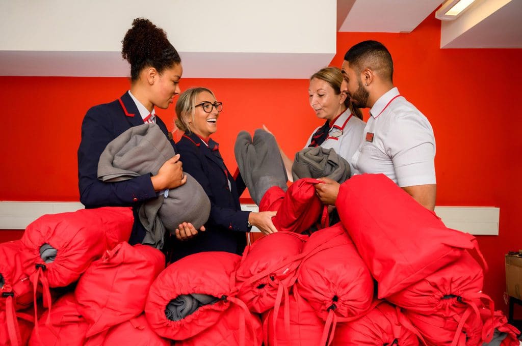 Scarves and blankets made from Virgin Trains staff's worn-out uniforms are being donated to people living on the streets.