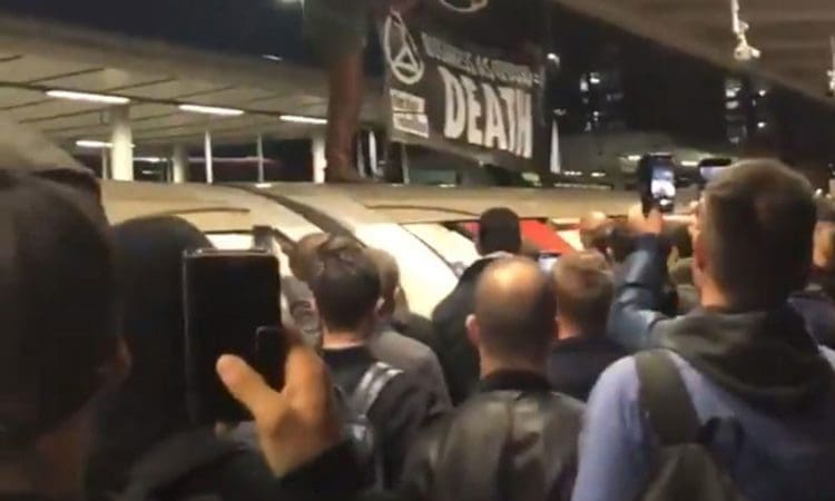 Ugly scenes as Extinction Rebellion protester is dragged from a Tube train.
