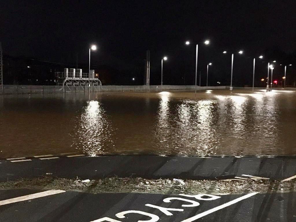 Flooding covering a road.